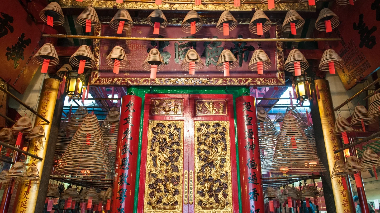 Altars and incense coils inside Man Mo Temple
